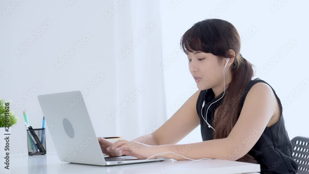 Beautiful young asian woman smiling say hello using chat social network with video call on laptop computer, teen girl relax enjoy communication and lifestyle concept. Beautiful young asian woman smiling say hello using chat social network with video call on laptop computer, teen girl relax enjoy communication and lifestyle concept.