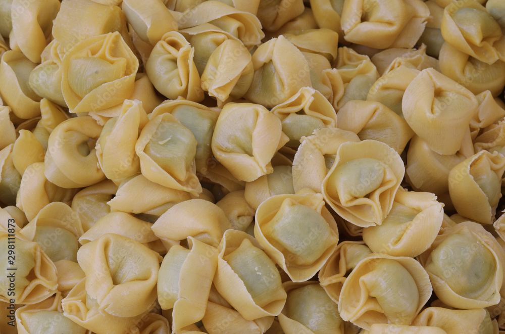 background of many italian pasta called Tortelli with spinach an background of many italian pasta called Tortelli with spinach an