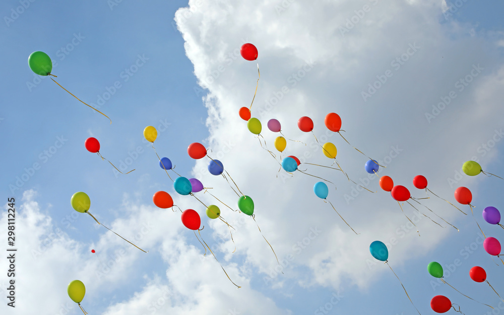 colored balloons fly up towards the sky colored balloons fly up towards the sky