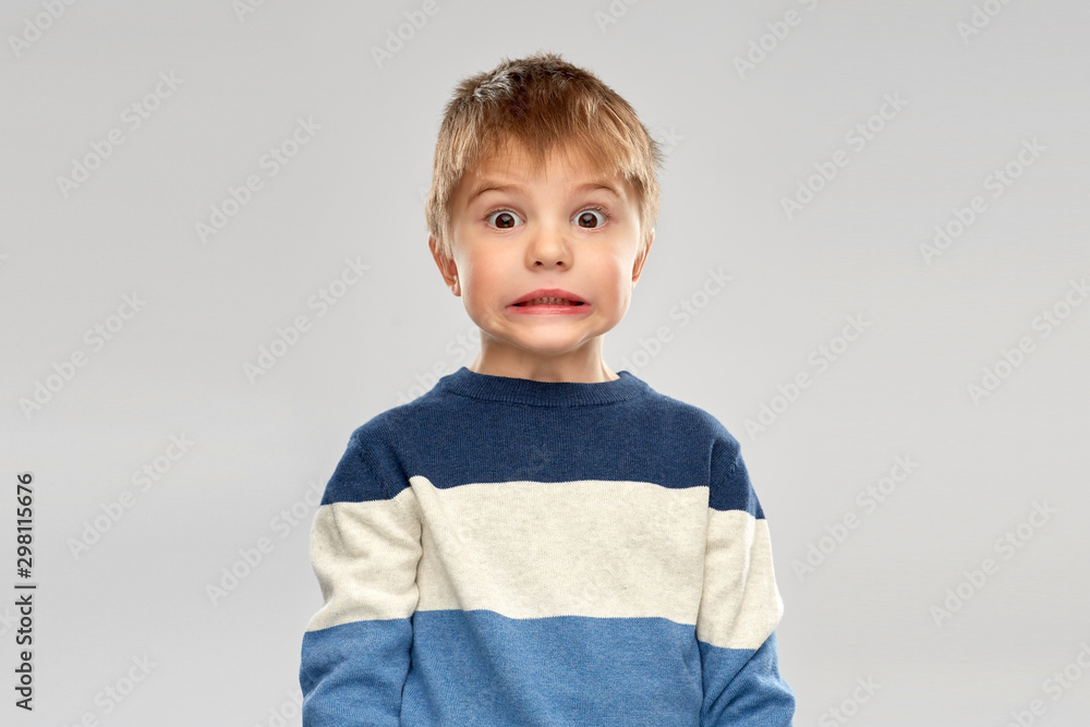 childhood, expressions and people concept - shocked little boy in striped pullover over grey background - obrazy, fototapety, plakaty 