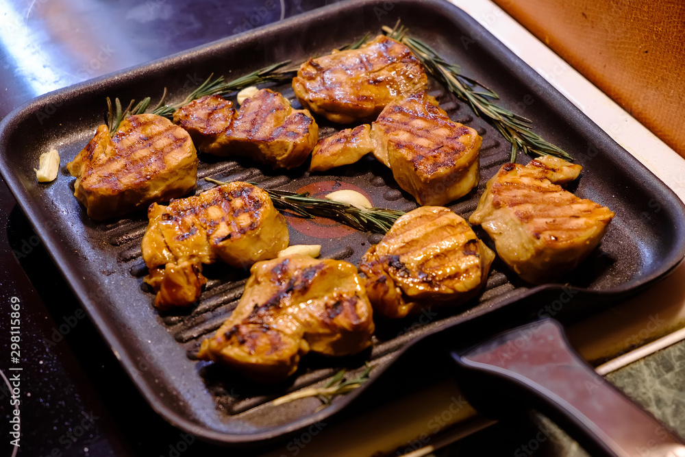 grilled beef steak with rosemary on frying pan grilled beef steak with rosemary on frying pan