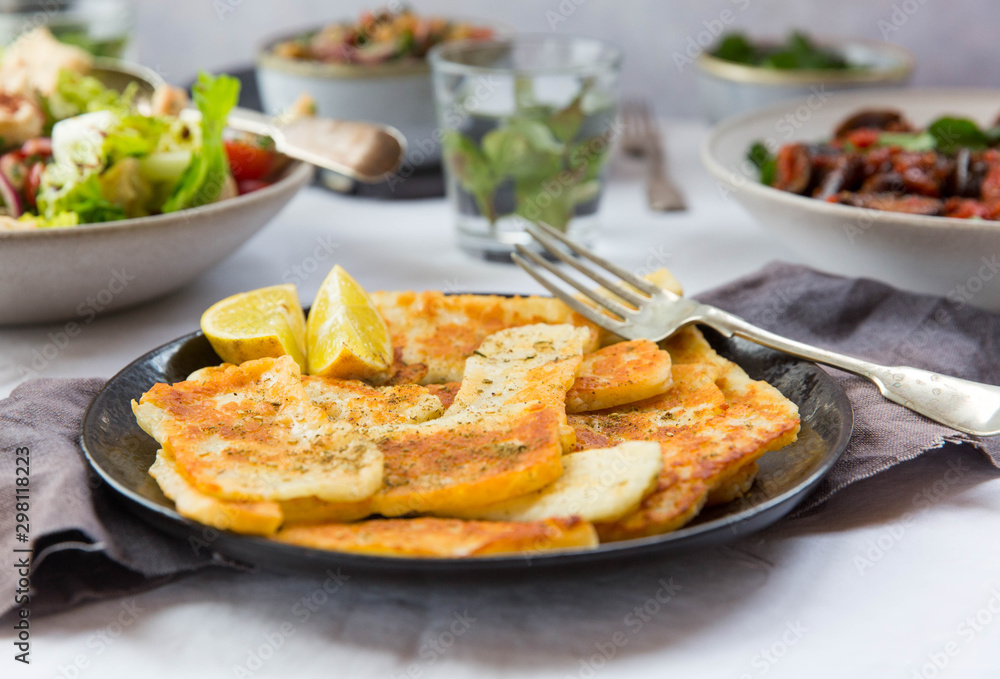 Middle eastern inspired mezze meal. Fried haloumi with za'atar. Middle eastern inspired mezze meal. Fried haloumi with za'atar.