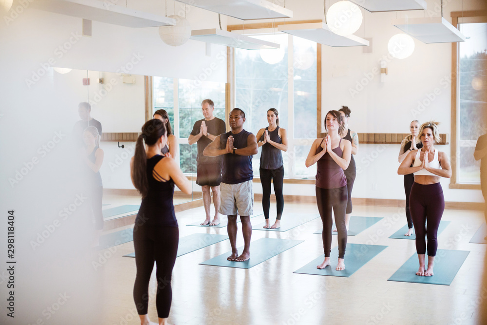 Yoga instructor teaching a class Yoga instructor teaching a class