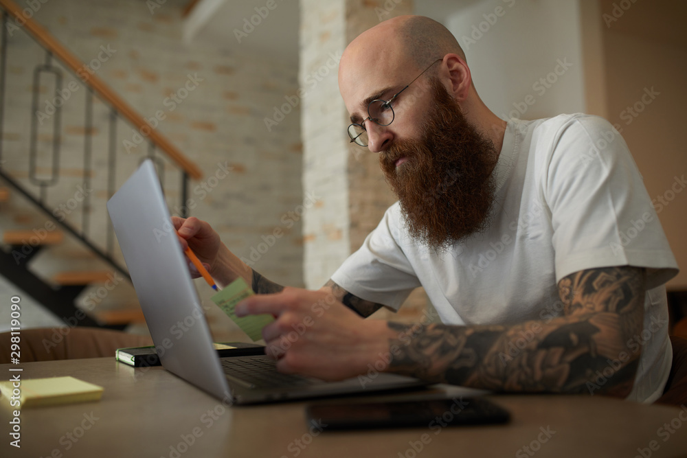 Young casual man working from home. Young casual man working from home.