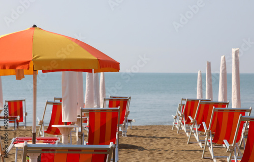 Fototapeta Naklejka Na Ścianę i Meble -  sunshade and deckchairs on the beach