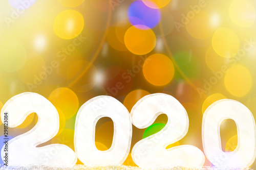 Happy new year 2020 isolated on black background with copy space for text, for holiday card. Blurred snowflakes, snow.