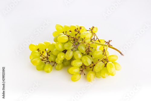 A bunch of green ripe grape raisins on white background