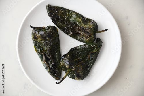 Close up of roasted poblano peppers served on plate