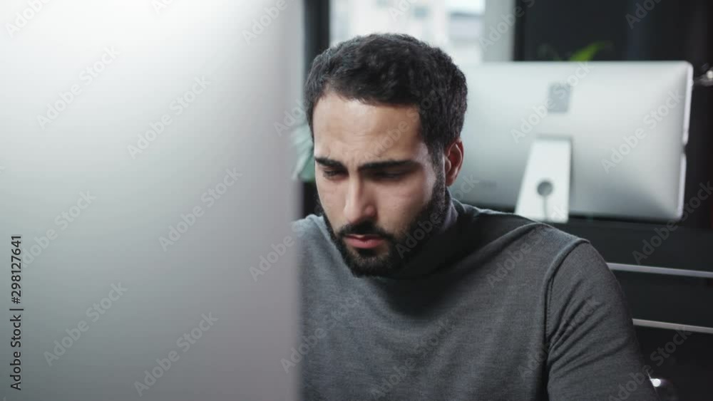 Unhealthy young business man coughing suffering fever or cold. Portrait of bearded sick office employee sneezing allergy with paper napkins at desktop table. Unhealthy young business man coughing suffering fever or cold. Portrait of bearded sick office employee sneezing allergy with paper napkins at desktop table.