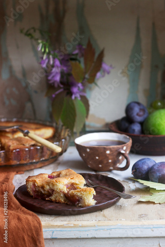 Plum pie or cake with cinnamon and sugar. Selective focus.