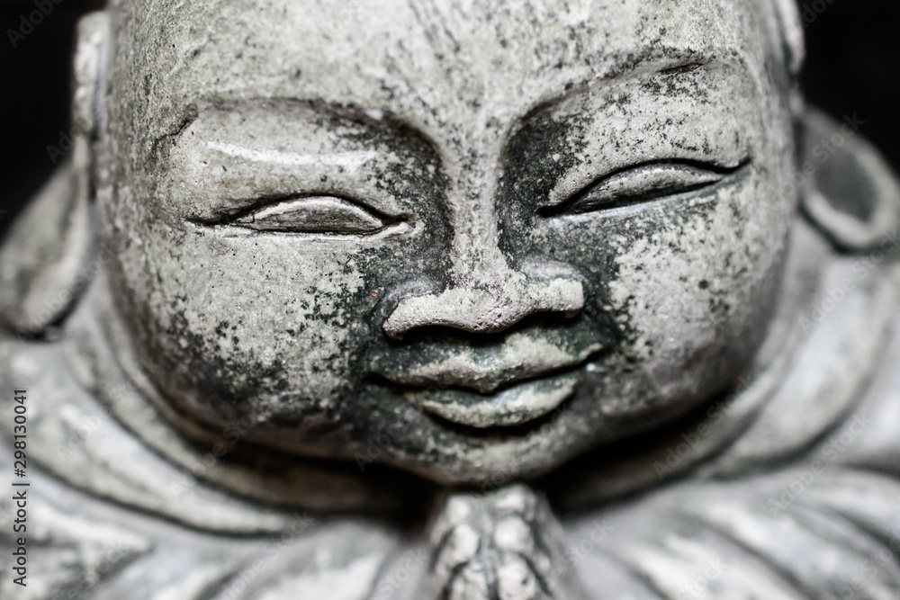 Closeup of a stone sculpture Buddah's face