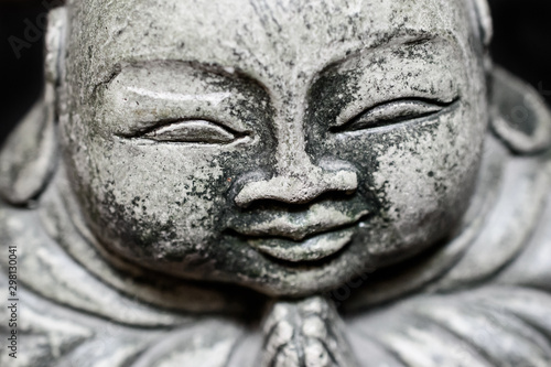 Closeup of a stone sculpture Buddah's face