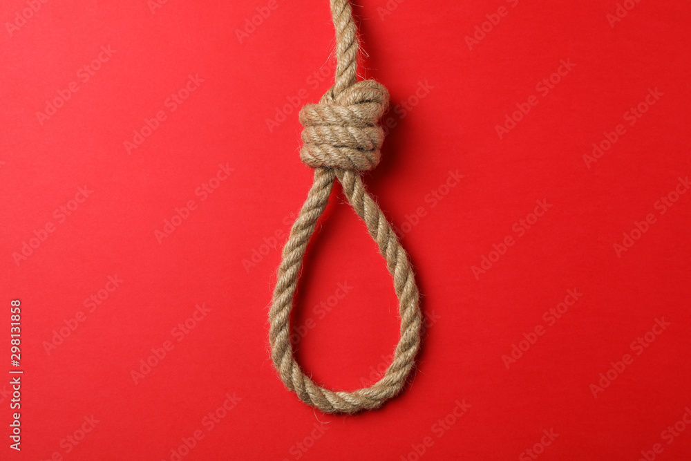 Suicide rope on red background, space for text
