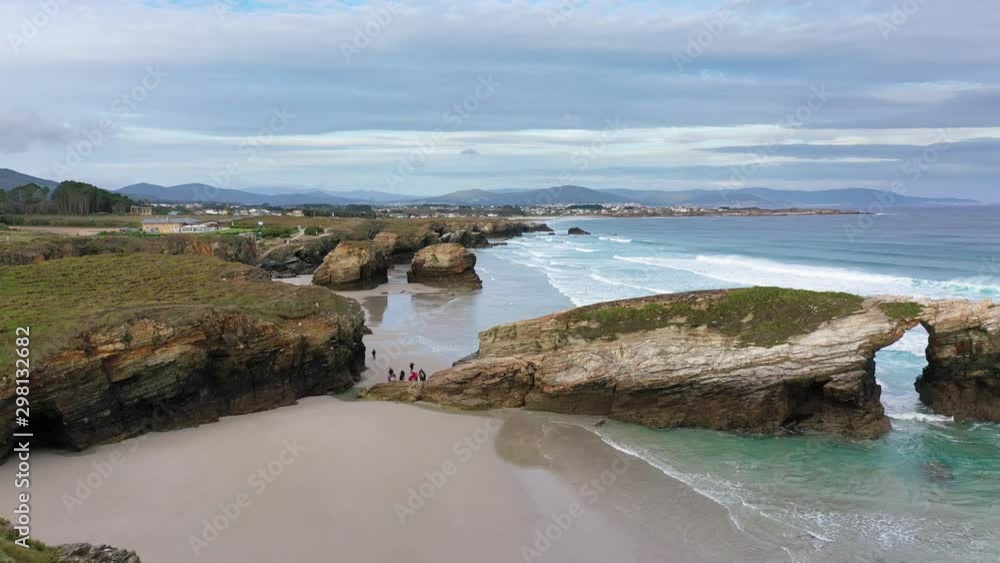 Playa de Las Catedrales (Beach of the Cathedrals) famous for its natural rock arches and caves in Ribadeo, Galicia, Spain Playa de Las Catedrales (Beach of the Cathedrals) famous for its natural rock arches and caves in Ribadeo, Galicia, Spain