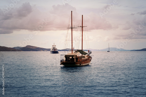 Beautiful boat in the sea at sunset