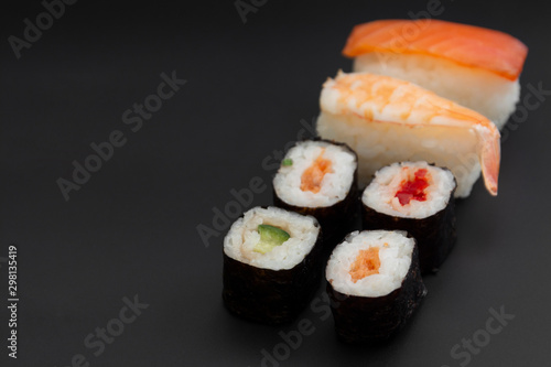 Japanese seafood sushi set on black background isolated, copy space