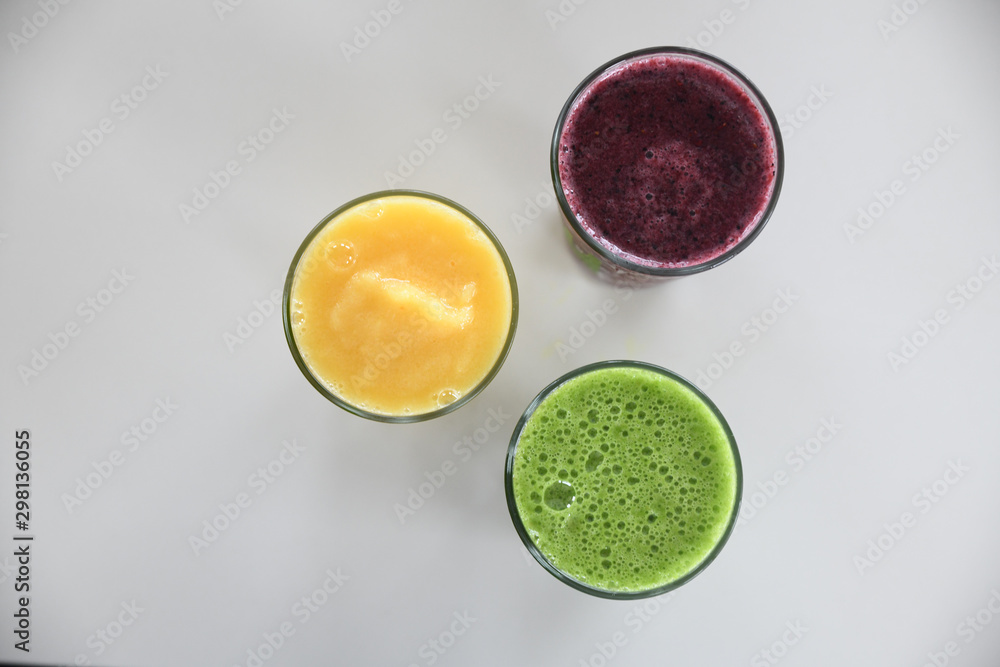 Overhead view of fruit smoothies served in glasses Overhead view of fruit smoothies served in glasses
