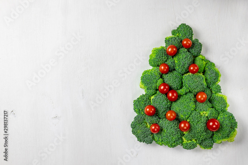 Edible Christmas tree shaped vegetable isolated on white background for holiday seasonal festive party celebration with healthy food decoration. Cooking step by step