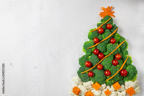 Edible Christmas tree shaped vegetable isolated on white background for holiday seasonal festive party celebration with healthy food decoration. Cooking step by step