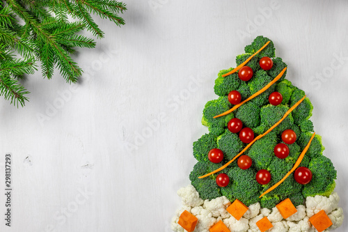 Edible Christmas tree shaped vegetable isolated on white background for holiday seasonal festive party celebration with healthy food decoration. Cooking step by step