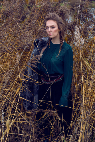 fashionable woman in a green sweater and a long skirt