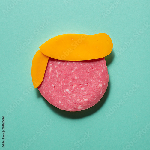 illustration representing a face made with cheese and salami photo