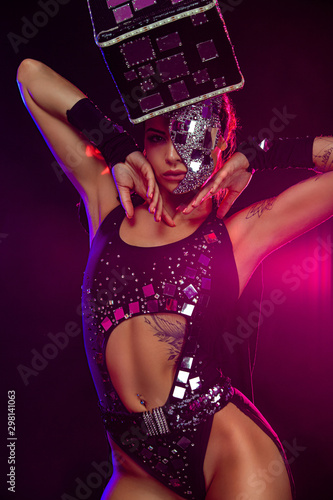 Photos Two beautiful go-go dancer girls in freak costumes on disco in color smoke