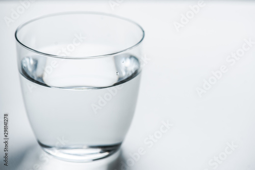 glass with water on a white background