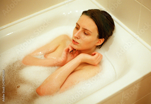 Young Androgyne woman in bath photo