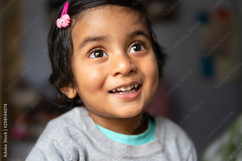 Portrait of a happy little girl laughing and smiling Portrait of a happy little girl laughing and smiling