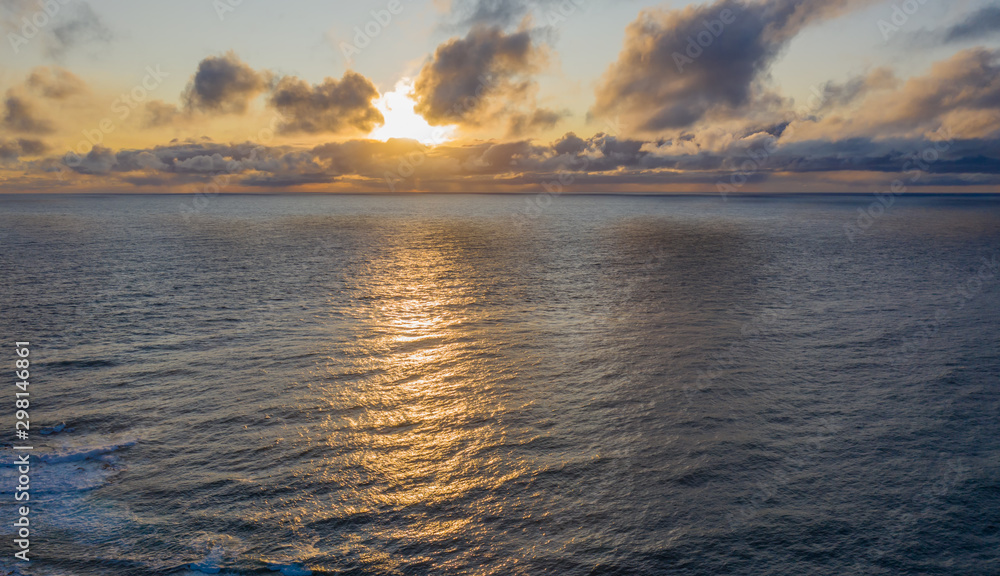 Sunset over the sea in westernmost part of Iceland, named Latrabjarg. Aerial drone view, september 2019