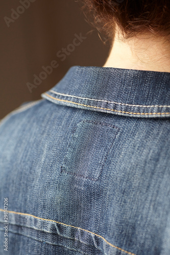 Model details wearing blue denim jacket