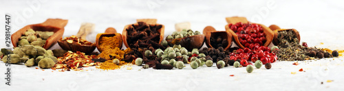 Spices with pepper on table. Food and cuisine ingredients for cooking on rustic background