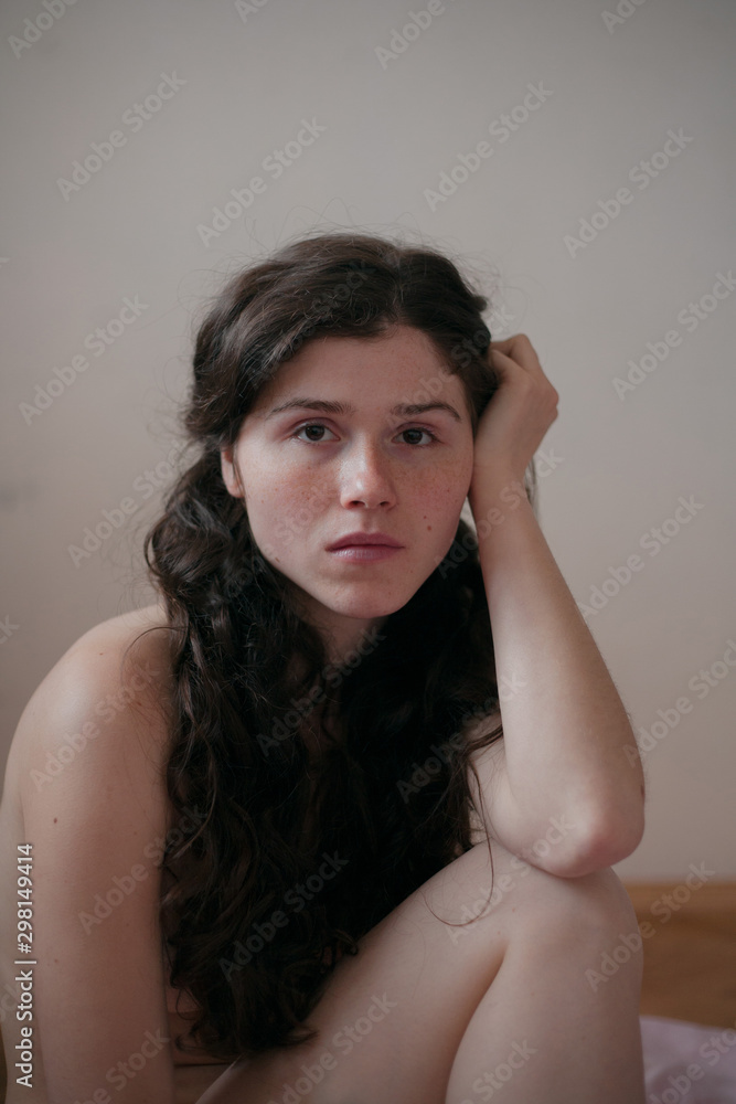 portrait of a beautiful girl with freckles on a neutral background portrait of a beautiful girl with freckles on a neutral background