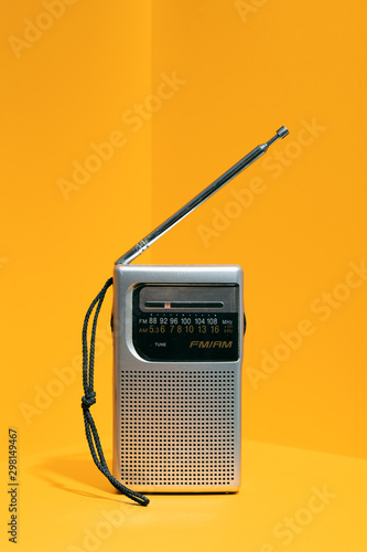 Retro Portable Radio On Yellow Background photo