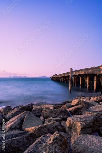 Wooden pier by sea photo