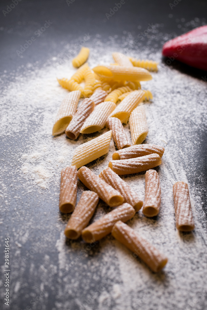 Pasta on black background close up vertical Pasta on black background close up vertical