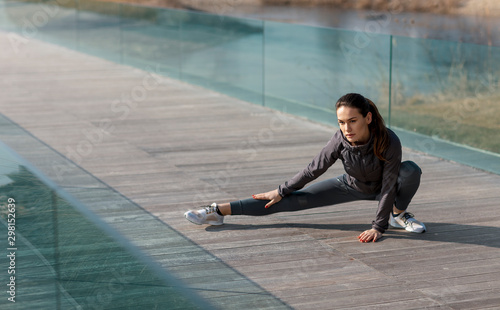 Active woman i sports wear stretching