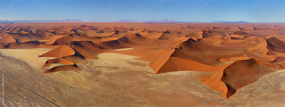 Aerial view of endless Namibia desert during daylight.