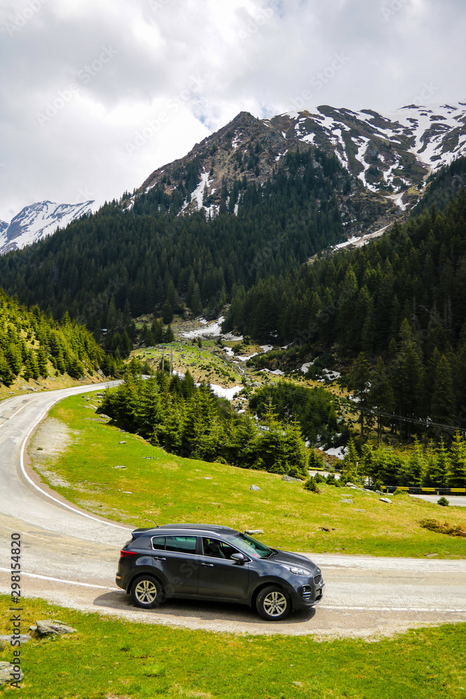 Slovakia, April 24, 2019: Kia Sportage stands on the side of a mountain road.