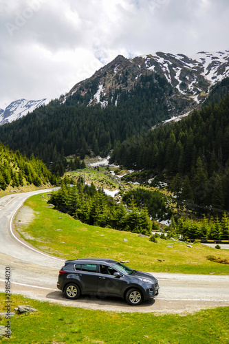 Slovakia, April 24, 2019: Kia Sportage stands on the side of a mountain road. photo
