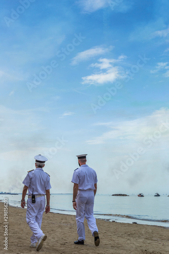 Navy officer looks at the beach during acrobatic air performance of Frecce tricolori in San Benedetto del Tronto - Italy - 9 june 2019