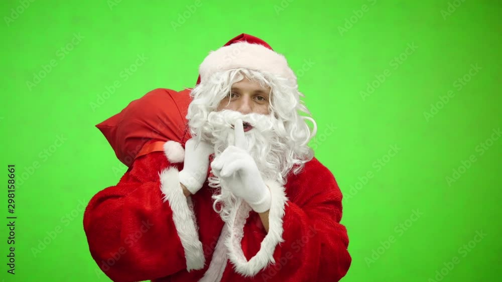 Santa asking for quiet with bag on green screen. close up Santa asking for quiet with bag on green screen. close up