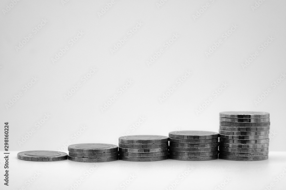 rows of coins and blurred bokeh for finance and banking concept rows of coins and blurred bokeh for finance and banking concept