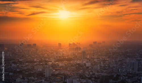 Bangkok District with Glowing Sun at Sunset