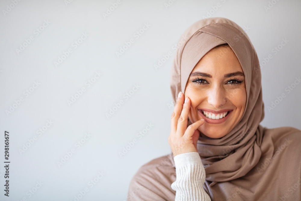 Young asian muslim woman in head scarf smile. Beautiful middle eastern woman wearing abaya. Arabian woman with happy smile. Strict formal outfit and elegant appearance. Islamic fashion. - obrazy, fototapety, plakaty 
