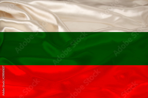 beautiful photo of the colored national flag of the modern state of Bulgaria on textured fabric  concept of tourism  emigration  economy and politics  close up
