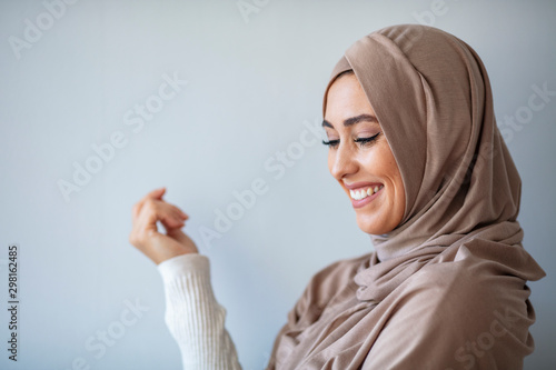 Portrait of pretty young asian muslim woman in head scarf smile. Pearl From The East. Smiling Muslim Woman Wearing Hijab. Modern, Stylish and Happy Muslim Woman Wearing a Headscarf