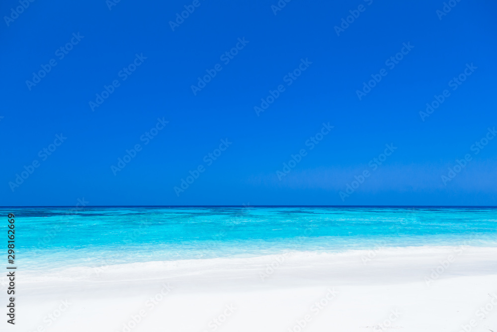White sand beach, clear water, deep blue sky in the tropical sea of ​​Thailand