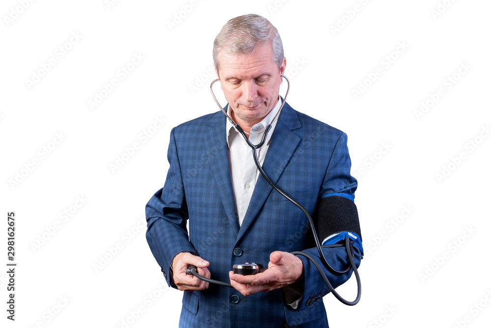 An elderly man in a suit measures pressure, by himself, with a hand tonometer. Isolated on a white background. An elderly man in a suit measures pressure, by himself, with a hand tonometer. Isolated on a white background.